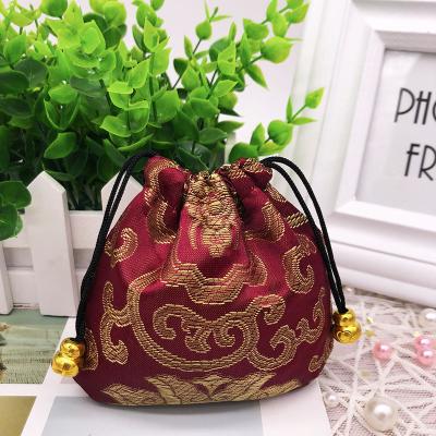 China Foshan Deqi Recyclable Jewelry Packaging Manufacture Custom Pink Color Silk Brocade Jewelry Pouches Bags With Zipper For Jewelry for sale