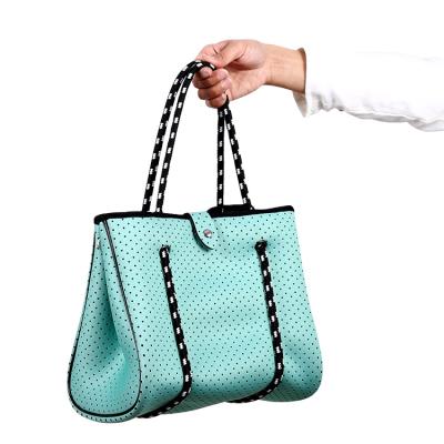 China Cheap And Fashion Eco - Friendly Neoprene Handbags With Perforated Pattern for sale