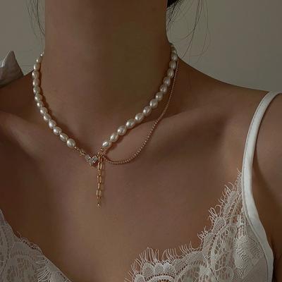 China Fashionable Light Luxury Personality Retro Love Pearl Asymmetrical Clavicle Chain Necklace 2021 New for sale