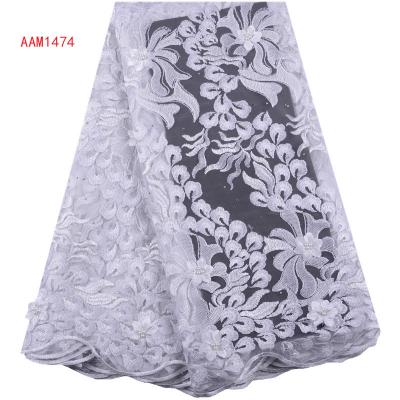 China Viable High Quality Pure White African Tulle Lace Fabric With French Net Lace Beautiful Beads 3D Flower Pattern Design For Wedding for sale