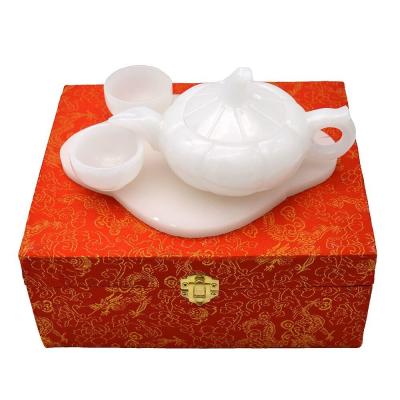 China Polished White Jade Tea Top Carving Craft in Chinese Style for High Class Home Decor for sale