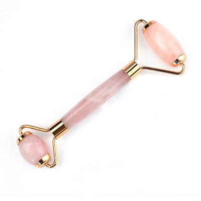 China Customized Logo Availabled Natural Rose Quartz Gold Handle Facial Jade Roller Pink Crystal Massager For Skin Beauty Treatment for sale