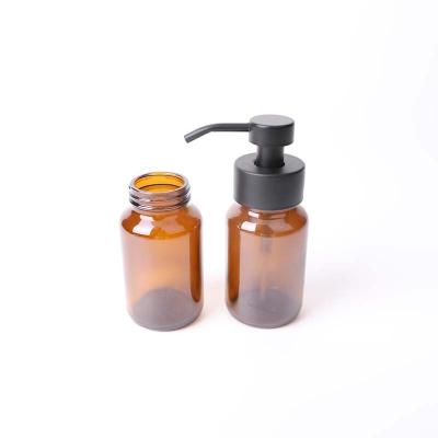 China Personal Care 150,200,250ml Brown Lotion Glass Bottle With Stainless Steel Pump For Hand Sanitizer for sale