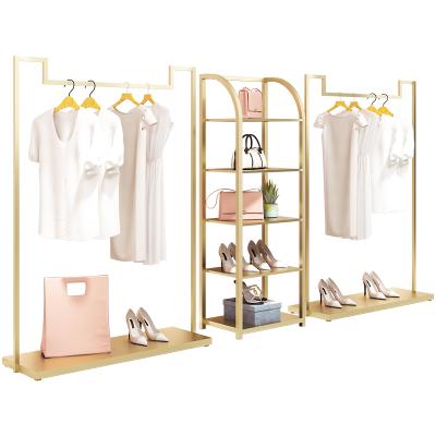 China Clothes Shop Custom Garment Rack Chrome Gold Clothing Rack Floor Standing Women Clothes Shop Display Rack Bag Rack for sale