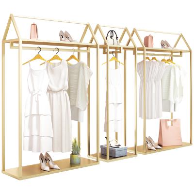 China Clothes Shop Nordic Women's Clothing Universal Boutique Rack Clothes Bag Vintage Shelving Rack Metal Gold Clothes Rack for sale