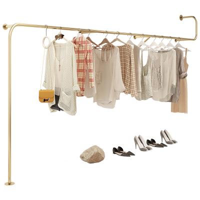 China Clothes shop new creative design shiny polished gold stainless steel women's clothing rack for sale