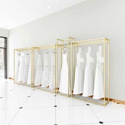 China Clothes shop custom store bridal decorations women boutique clothing display metal racks stainless steel gold wedding dress racks for clothes for sale