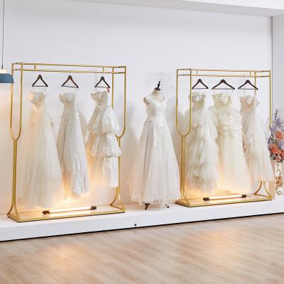 China Clothes shop store decoration gold metal boutique clothing shelf commercial dresses show store wedding rack for dress display for sale