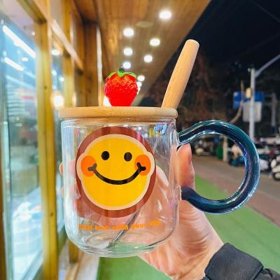 China Cartoon Viable Smile SOULCHE Glass Cups With Lids And Spoon Handle Colorful Creative Big Glass Mug With Berry Lid And Spoon for sale