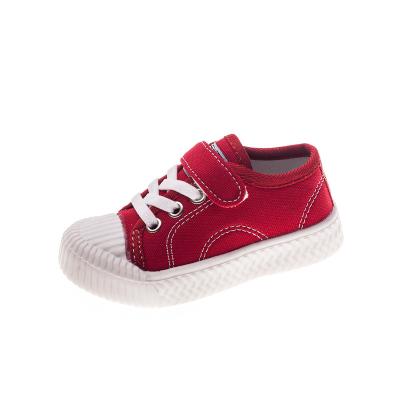 China Breathable Wholesale Kids Size 2 7 Toddler Boys Plain Girls Kids White Canvas Shoes for sale