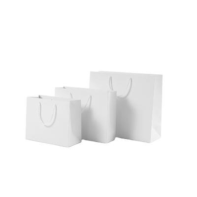 China Recyclable Wholesale Luxury Custom Printing Gift Packaging Paper Shopping Bags With Logos for sale