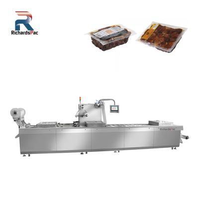 China Automatic Food Dates Thermoforming Vacuum Packing Machine for sale