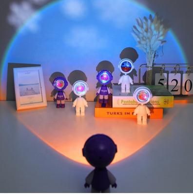 China Mistei Mini Cute Dawn Sunset Light Modern Robot Led Lamp Astronauts Rainbow Projection Projector Desk Lights For Wholesale for sale