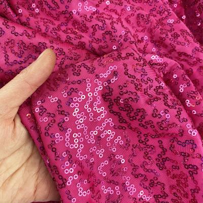 China Neon Pink Embroidered Metallic Shimmer Sequin Fabric Stretch For Dancewear Dress Sewing 2021 New for sale