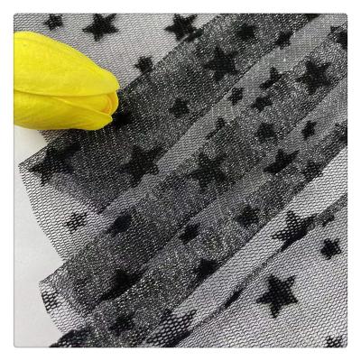 China Stretch 2022 New Nylon+Spandex Mesh Flocked Metallic Dress Fabrics Sexy Stars DIY Costume Fabric Dance Wear Halloween Designs for sale