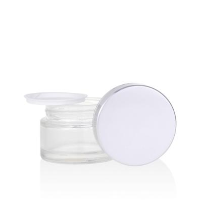 China Skin Care Skin Care Cream Containers And 50g 50ml Round Shape Clear Glass Cosmetic Cream Jar With Matte Silver Lid for sale