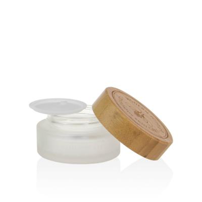 China Eco Friendly Skin Care Cosmetic Packaging 15ml 30ml 50ml 100ml Frosted Glass Jar With Bamboo Lid for sale