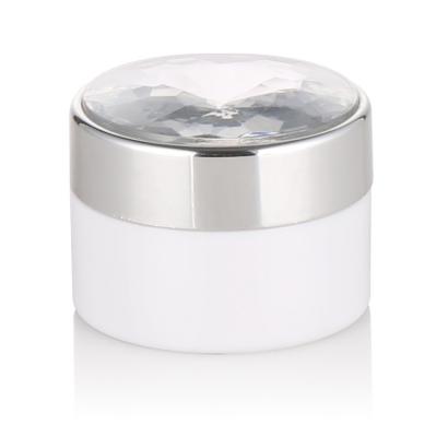 China Skin Care Cream Cosmetic Packaging 50g 50ml White Plastic Cosmetic Jar Container With Silver Cap And Diamond Top for sale