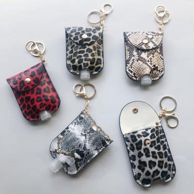 China Leopard and Snake Print Travel Bottle Key Chain Holder Disinfect Hand Sanitizer Leather Containers 30ml Leakproof Reusable Bottle Key Chain for sale