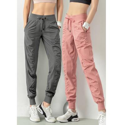 China Breathable Running Women Sports Joggers Gym Fitness Quick Dry Sport Sweatpants With Bilateral Pockets Exercise Pants for sale