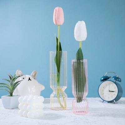 China Traditional high quality curved tubular glass vases can be made to decorate colorful bedrooms for sale