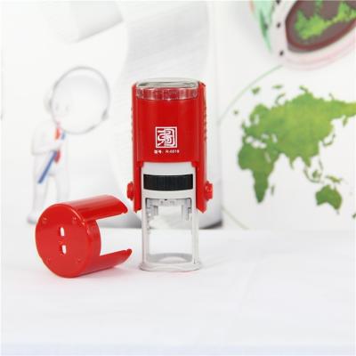 China Decoration factory supply small round 12mm face stamp pad smile Self-inking round stamp for kids for sale