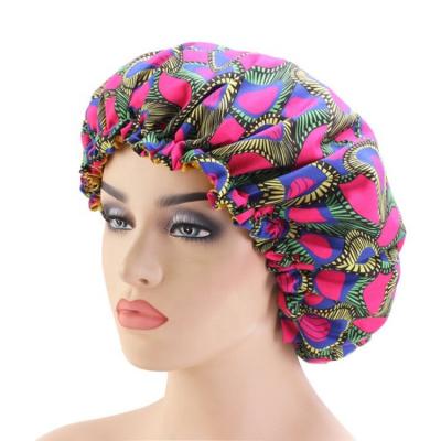 China Popular Image Reversible Batik Printing Line Hood Sleep Double Layer Satin Headdress Hat for sale