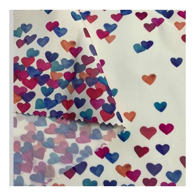 China Waterproof Polyester Staple Fiber Fabric With Love Heart Printed Waterproof For Cloths And Jackets for sale