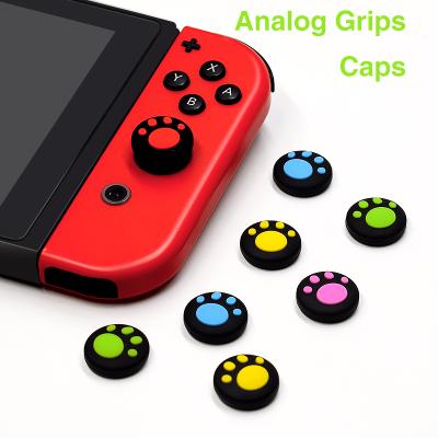 China Cat Paw Design Cat Paw Footprint Thumb Stick Grips Switch Silicone Thumb Grips For Nintendo Switch Joy-Con for sale