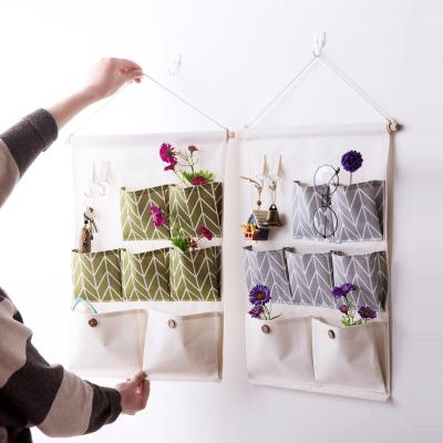 China Viable Household Goods Seven Pockets Wall Hanging Storage Bag Dormitory Storage Organizer Sundries Hanging Bag for sale