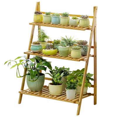 China Multifunctional Balcony Garden Stored A Trapezoidal Type Plant Storage Rack Bamboo And Flower Wooden Folding Rack for sale