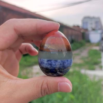 China 2022 Wholesale China Crystals Healing Quartz Carving 7 Seven Chakra 45MM Colors Gemstone Crystal Egg Crystal Craft for sale