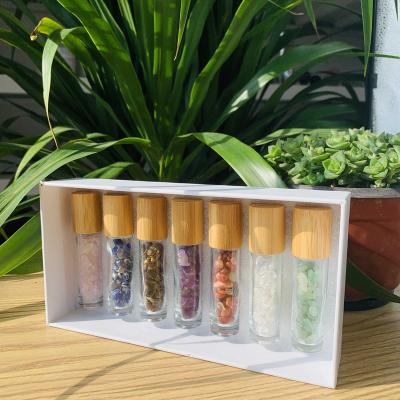 China Wholesale Europe 2022 Natural Massage Bottle Crystal Essential Oil Roller Bottle Rose Quartz Healing Gemstone Oil With Bamboo Lid for sale