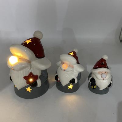 China Europe 2022 Latest Style Christmas Decoration Festival Ceramic Ornament Led Light Santa Figure Home Decor for sale