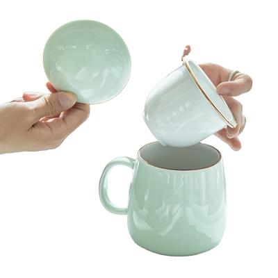 China Viable Rim Glazed Tea Separation Mug Gold Lid Tea Filter Infuser Desktop Ceramic Mug Set for Tea with Infuser and Lid for sale