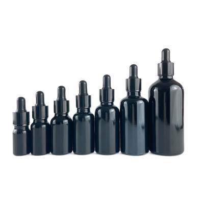 China Non puddle in stock 5ml 10ml 15ml 20ml 30ml 50ml 100ml black glass dropper bottle with dropper for sale