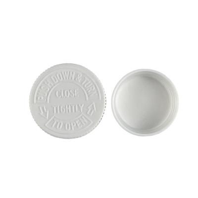 China Non Spill 28 Mm White Black Child Resistant Caps For Child Proof Bottle for sale