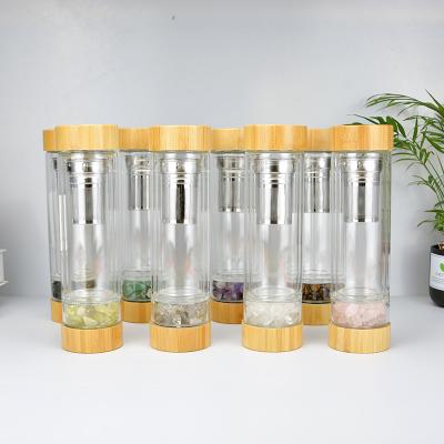 China Hot Selling Viable Double Wall Glass Water Bottle With Crystal Stones Bamboo Lid Quartz Stone Water Bottle for sale