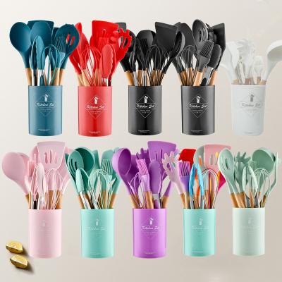 China Wholesale 11 Pcs Viable Set Kitchenware Cooking Spoon Spatula Silicone Cooking Utensils With Wooden Handle for sale