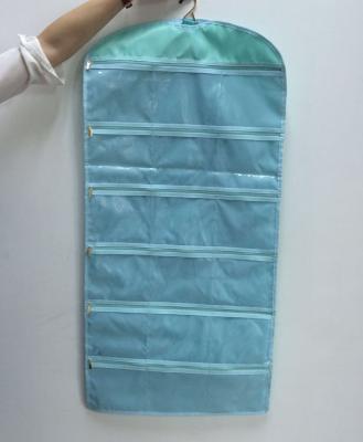 China Promotion Blue Polyester Hanging Jewelry Bag Roll With Pockets for sale