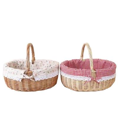 China 2 Bag Eco-friendly Chinese Handmade Fruit Food Basket Weave Plant Willow Plant Round Oval Rattan Picnic Basket With Handle for sale