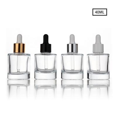 China Skin Care Oil 30ml 40ml 50ml Flat Shoulder Round Essential Oil Bottle Skin Care Serum Clear Glass Cosmetic Dropper Bottle for sale