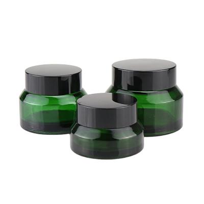 China Hot Selling Cosmetics 15g 30g 50g Slanted Shoulder Facial Cream Green Glass Jar With Gloden Lid For Makeup Packaging for sale