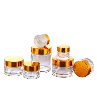 China 5g 10g 15g 20g 30g cosmetic top selling transparent cream glass jar with gold lid for cosmetic for sale