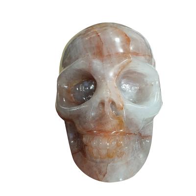 China Europe High Quality Natural Polished Hand Carved Folk Crafts Red Hematoid Skulls Healing Crystals Stone Skulls For Decoration for sale