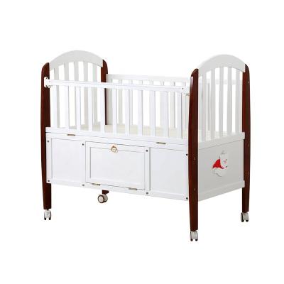 China 2020 Modern New Zealand Pine Wood Baby Crib With Storage Room for sale