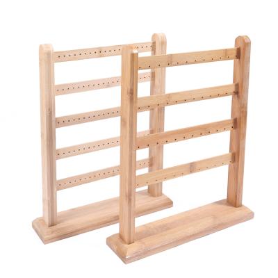 China Fashion Elegance Luxury Simplicity Wholesale Rack 4 Tier Ear Studs Earring Stand 48 Holes With Wooden Base Jewelry Display Earring Stand for sale