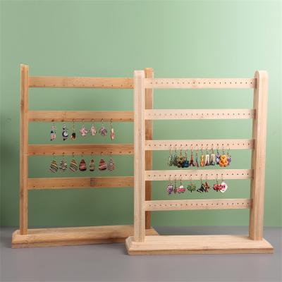 China Fashion Elegance Simplicity Earring Stand 48 Hole Luxury Jewelry Rack Wooden Display Sets Vertical Earring Jewelry Shelving Storage Display for sale