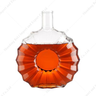 China Customized Creative Embossed Transparent Glass Bottle High End Large Capacity Beverage Glass Bottle For Brandy Whiskey Vodka Rum Tequila for sale