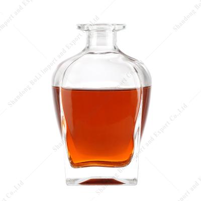 China Beverage Customized Shape With Square Bottom Glass Bottle For Rum Brandy Whiskey Tequila Vodka With Cap 700ml 750ml 1000ml for sale